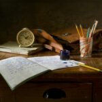 Classic wooden desk with writing materials, vintage clock, and a leather bag.